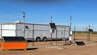 photo of a monitoring trailer in the field