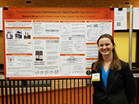 photo of grad student melanie standing by her poster